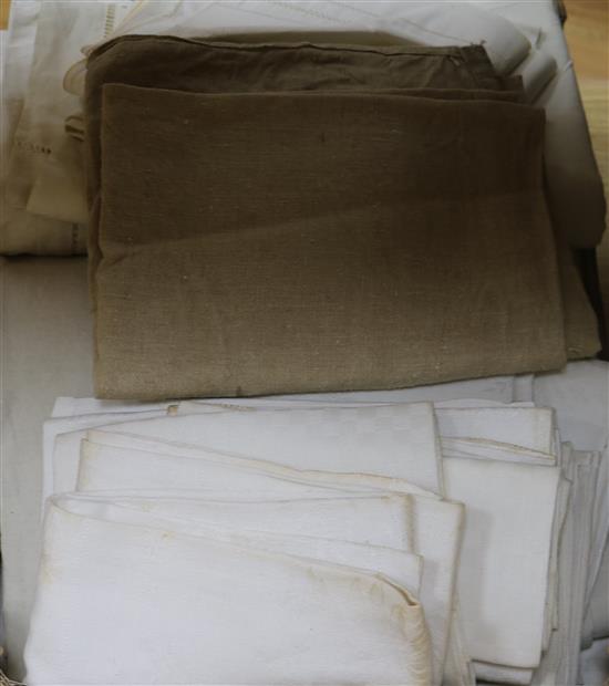A quantity of mixed French provincial linens: sheets, table cloths, napkins etc